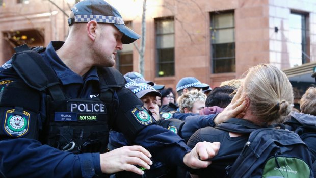 Police jostle with anti-Reclaim Australia protesters in Martin Place.