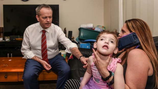 Federal Opposition leader Bill Shorten with Cherie Dell and her daughter Abbey, 3, who suffers from the very rare genetic disorder CDKL5.