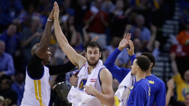 Chemistry: Andrew Bogut and his Golden State Warriors teammates celebrate during the game against the Atlanta Hawks at the Oracle Arena in Oakland.