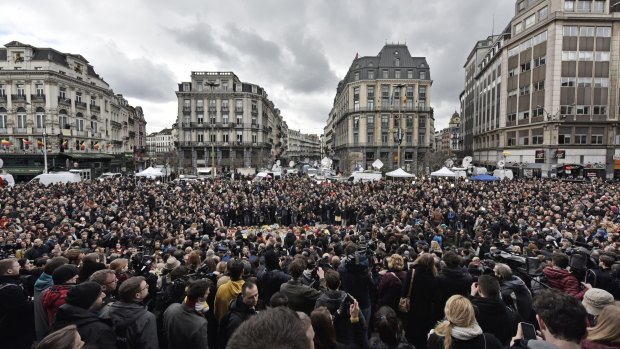 People observe a minute of silence at the Place de la Bourse in the centre of Brussels on Wednesday.
