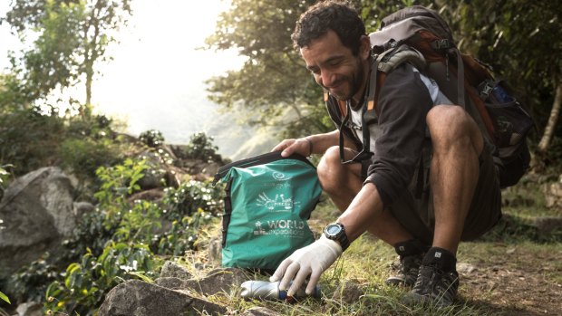 Tidying up while enjoying a trek is one of many volunteer options available to travellers.