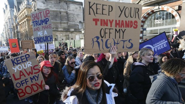 Demonstrators take part in the Women's March on London last year.