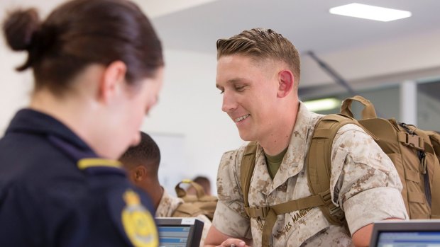 United States Marines are met by Australian Border Force personnel at Air Movements after arriving in Darwin as part of the Marine Rotational Force.