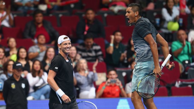 Opposites attract: Tomas Berdych and Nick Kyrgios playing for the Singapore Slammers in 2014.