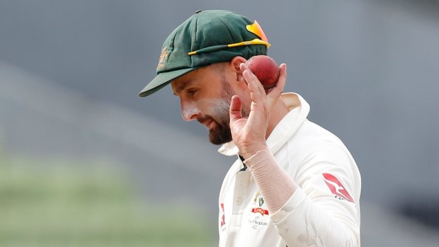 Australia's Nathan Lyon acknowledges the crowed after taking six Bangladeshi wickets during the third day of their first test cricket match in Dhaka, Bangladesh, Tuesday, Aug. 29, 2017. (AP Photo/A.M. Ahad)