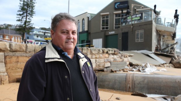 The CEO of The Beach Club hotel at Collaroy, Robert McConnell pictured with the damaged building.