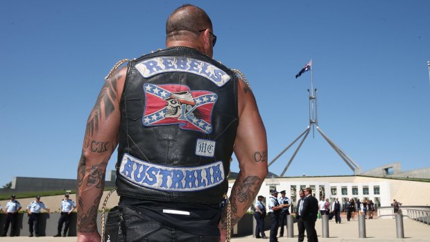 A patched Rebels member who was among riders protesting bikie laws at Parliament House in Canberra in December 2014. 