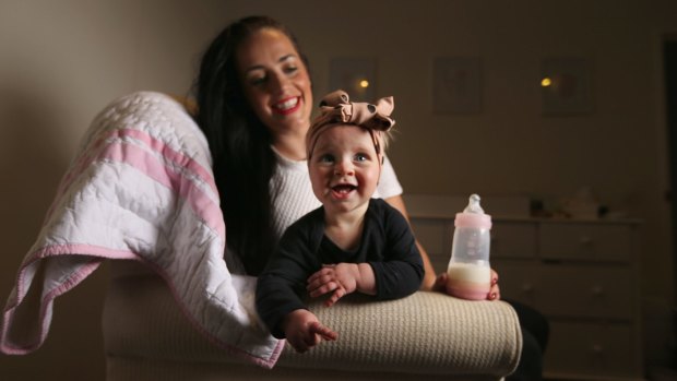 Tara Lloyd feeds her 8-month-old daughter Gracie Perkin a2 Platinum infant formula.