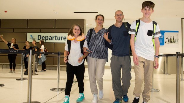 Kristie Ward and Jim Walters with children Ethan and Ashlyn at Sydney Airport on Friday.