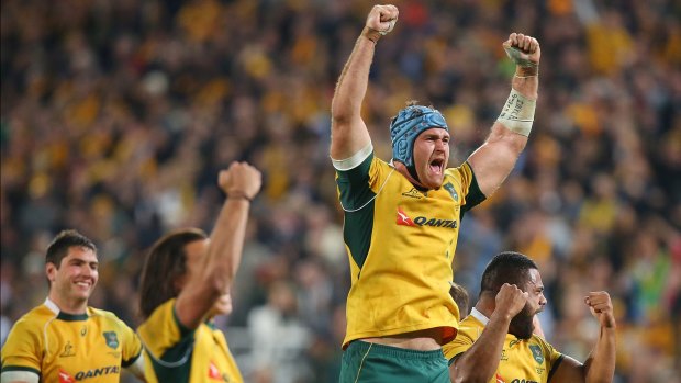 Jumping for joy: James Horwill and the Wallabies celebrate victory over South Africa.