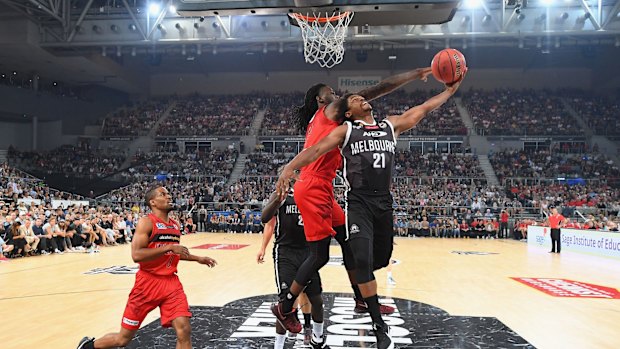 Up and under: United's Casper Ware drives to the basket against the Wildcats.