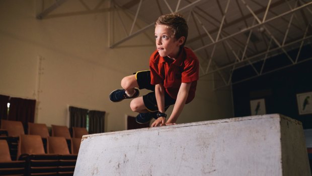 High-flyer: North Ainslie pupil Gus Warfield, 9, learns the art of parkour at school.