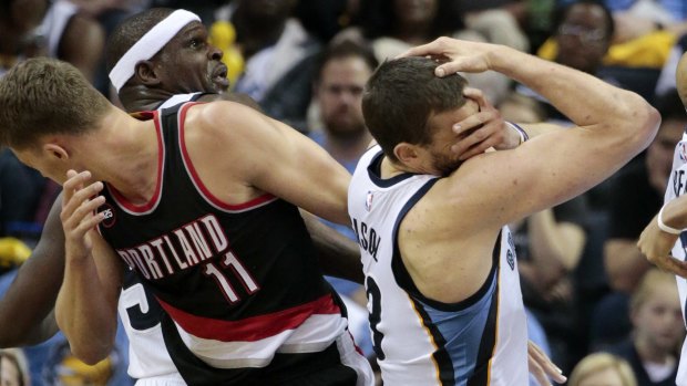 Banging bodies: Portland Trail Blazers centre Meyers Leonard and Memphis Grizzlies counterpart Marc Gasol recoil after colliding. The Grizzlies won 100-86. 