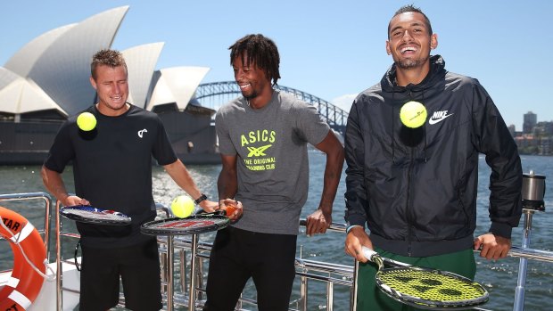 Having a ball: Lleyton Hewitt, Gael Monfils and Nick Kyrgios pose during a Fast 4 media opportunity on Sydney Harbour on Monday.