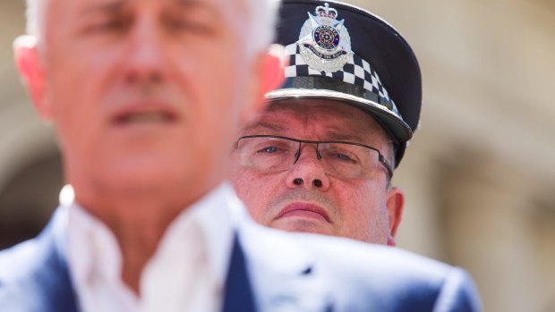 Hunt for answers: Chief Commissioner Graham Ashton and Prime Minister Malcolm Turnbull pay tribute to the Bourke Street victims. 