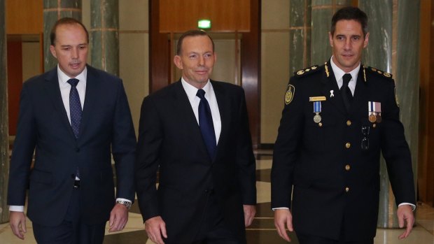 Prime Minister Tony Abbott attended the swearing in ceremony of the inaugural Border Force Commissioner Roman Quaedvlieg with Immigration minister Peter Dutton at Parliament House.