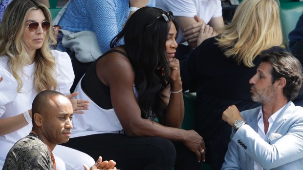 Serena Williams watched her older sister from the stands.