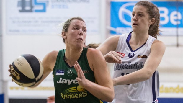 On target: Dandenong's Sara Blicavs drives to the basket past Adelaide's Jessica Good.