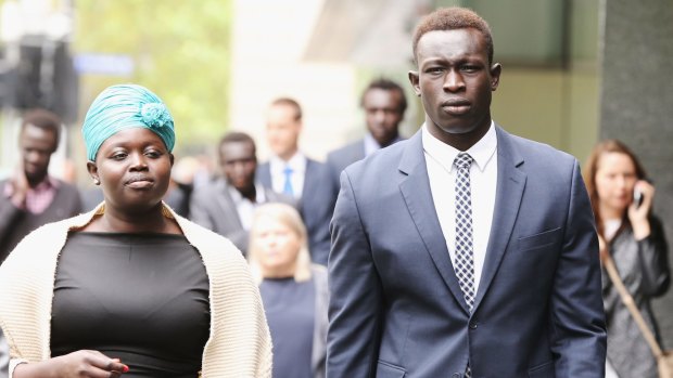 Former North Melbourne footballer Majak Daw outside the County Court on Monday with his sister, Sarah Daw.