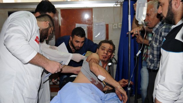 Doctors treat a man who was injured in the attack.