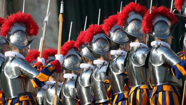 Swiss guards attend Pope Francis' "Urbi et Orbi" blessing message in St Peter's Square on Friday.