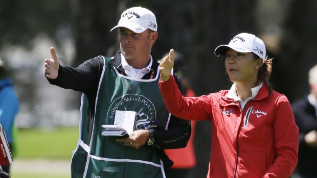 Lydia Ko gets direction from her caddie.
