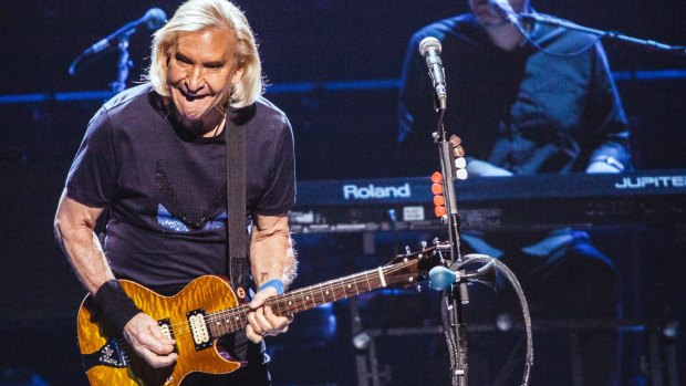 Joe Walsh's impassioned guitar solos were among the night's few unpredictable elements.