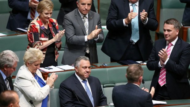 Joe Hockey is applauded by colleagues after his speech.