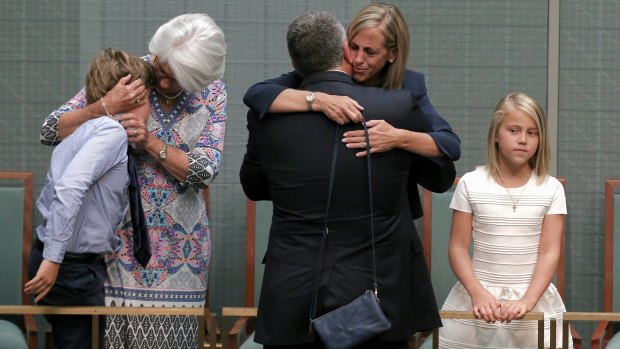 Joe Hockey embraces by his wife Melissa Babbage after his final speech to Parliament in October.