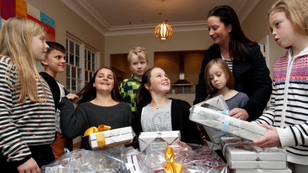 Building bonds: Kylie Macdonald and children involved in Kids in Philanthropy with the prizes for their fund-raising gala.