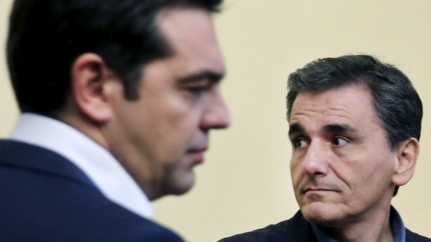 Tsakalotos looks on during his swearing in ceremony with Greek Prime Minister Alexis Tsipras.