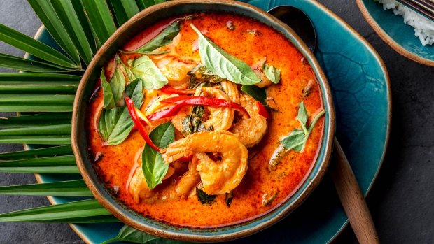 Red curry soup with shrimps prawns and coconut milk. 