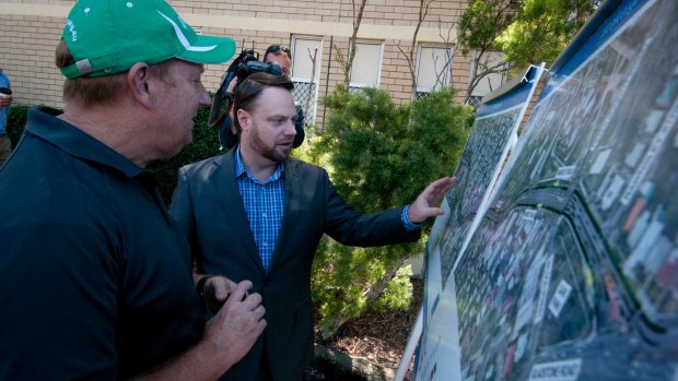 Deputy mayor Adrian Schrinner and Bicycle Queensland's Andrew Demack look over the plans for the cycling "superhighway" at Woolloongabba.