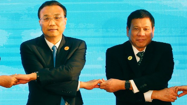Uncertain ties: Chinese Premier Li Keqiang, left, and Philippines President Rodrigo Duterte at the ASEAN Plus Three summit in Vientiane, Laos, in September.