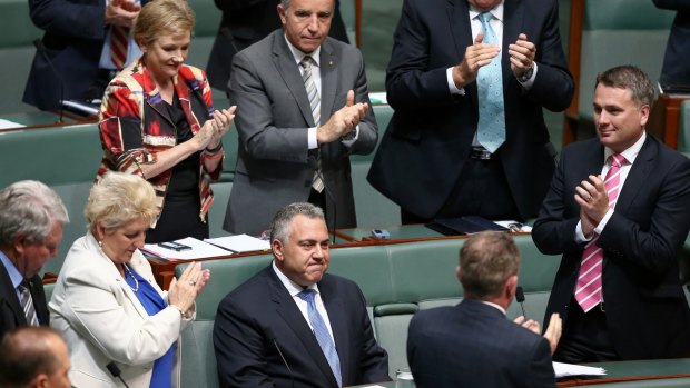 Mr Hockey is applauded by colleagues after his speech.