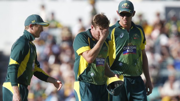 James Faulkner (centre) leaves the ground after sustaining an injury during the one-day series final against England.