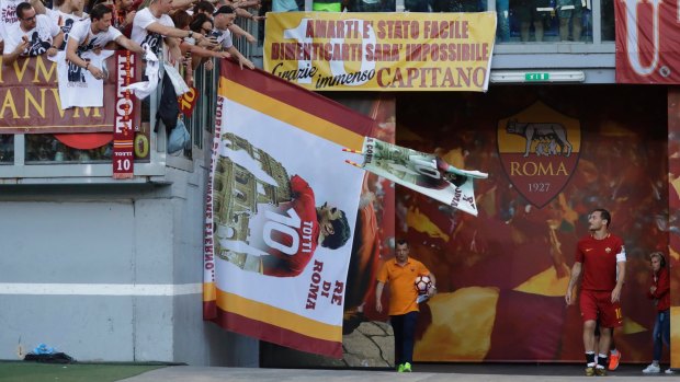 Francesco Totti enters the field for his final salute to his fans.