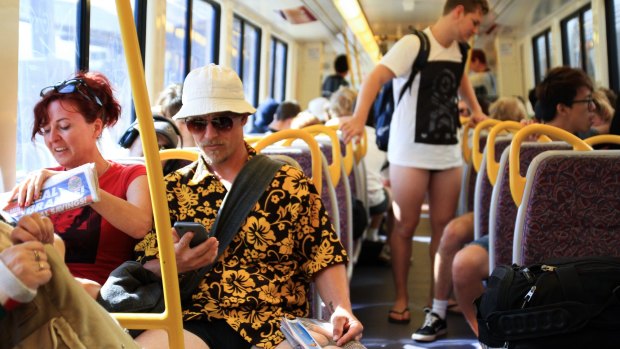 Commuters enjoy the Brisbane No Pants Subway Ride.