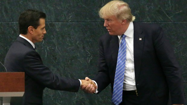 Mexican President Enrique Pena Nieto and Republican presidential nominee Donald Trump shake hands.