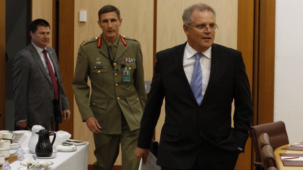 Martin Bowles with then immigration minister Scott Morrison and Lieutenant General Angus Campbell in 2014.