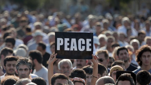 Demonstrators call for peace at a rally in Istanbul on Sunday.