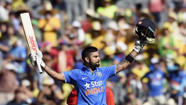 Milestone: India's Virat Kohli celebrates after scoring a century against Australia.