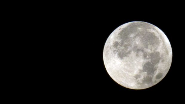 A supermoon is seen at the end of a lunar eclipse above Antwerp, Belgium on Monday.