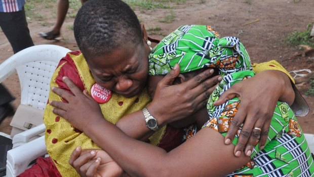 "Bring Back Our Girls" co-founder Obiageli Ezekwesili, left, consoles Esther Yakubu after she saw her daughter a video released by Boko Haram.