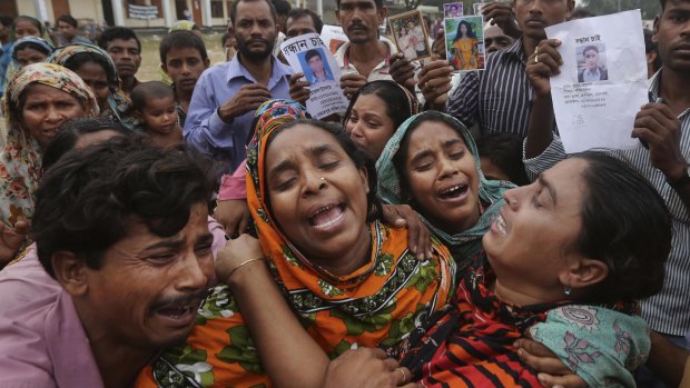 Relatives of Mohammed Abdullah, garment worker in Rana Plaza, cry as they as they arrive to collect his body near Dhaka, Bangladesh.