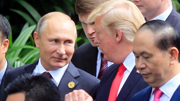 Russian President Vladimir Putin, left, told and US President Donald Trump Russia did not meddled in the US elections.