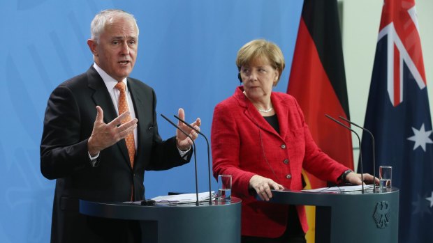 Prime Minister Malcolm Turnbull addresses the media with German Chancellor Angela Merkel following talks at the Chancellery. Turnbull said 'there needs to be a political solution' in Syria.