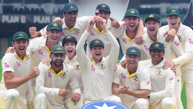 Too good: The Australian team  celebrate after their 4-0 win in the Ashes.