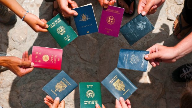 Why is every passport in the world said to feature a varying shade of either red, green, black or blue?