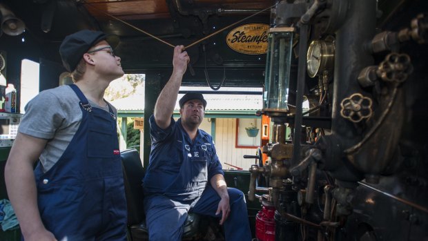 Mitchell Allen in the 6029, the largest steam train in the southern hemisphere, with Canberra Railway Museum operations manager Les Coulton.